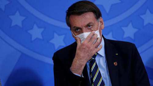 巴西总统确诊后面对记者摘口罩